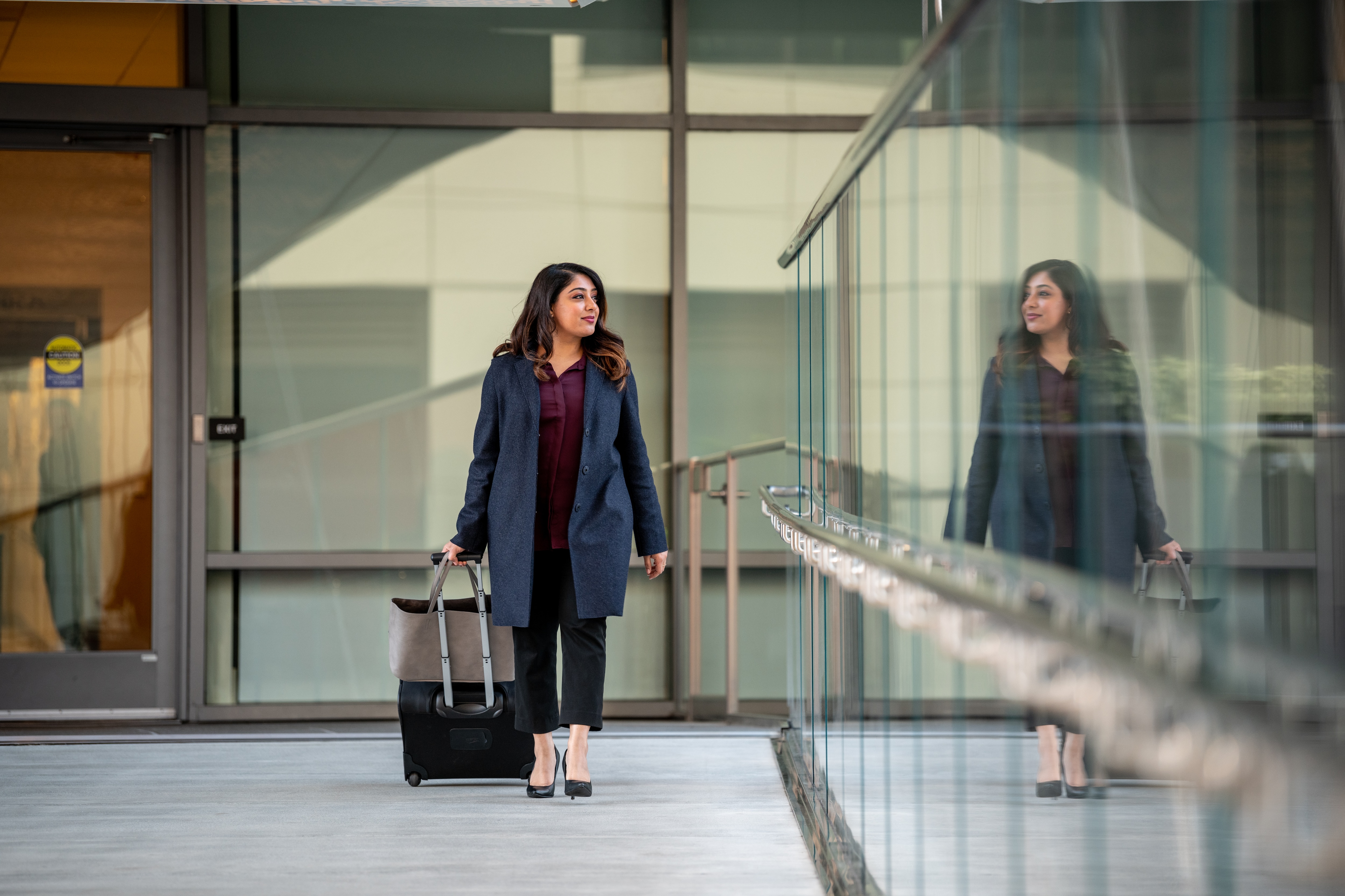 woman business traveler walking with her suitcase