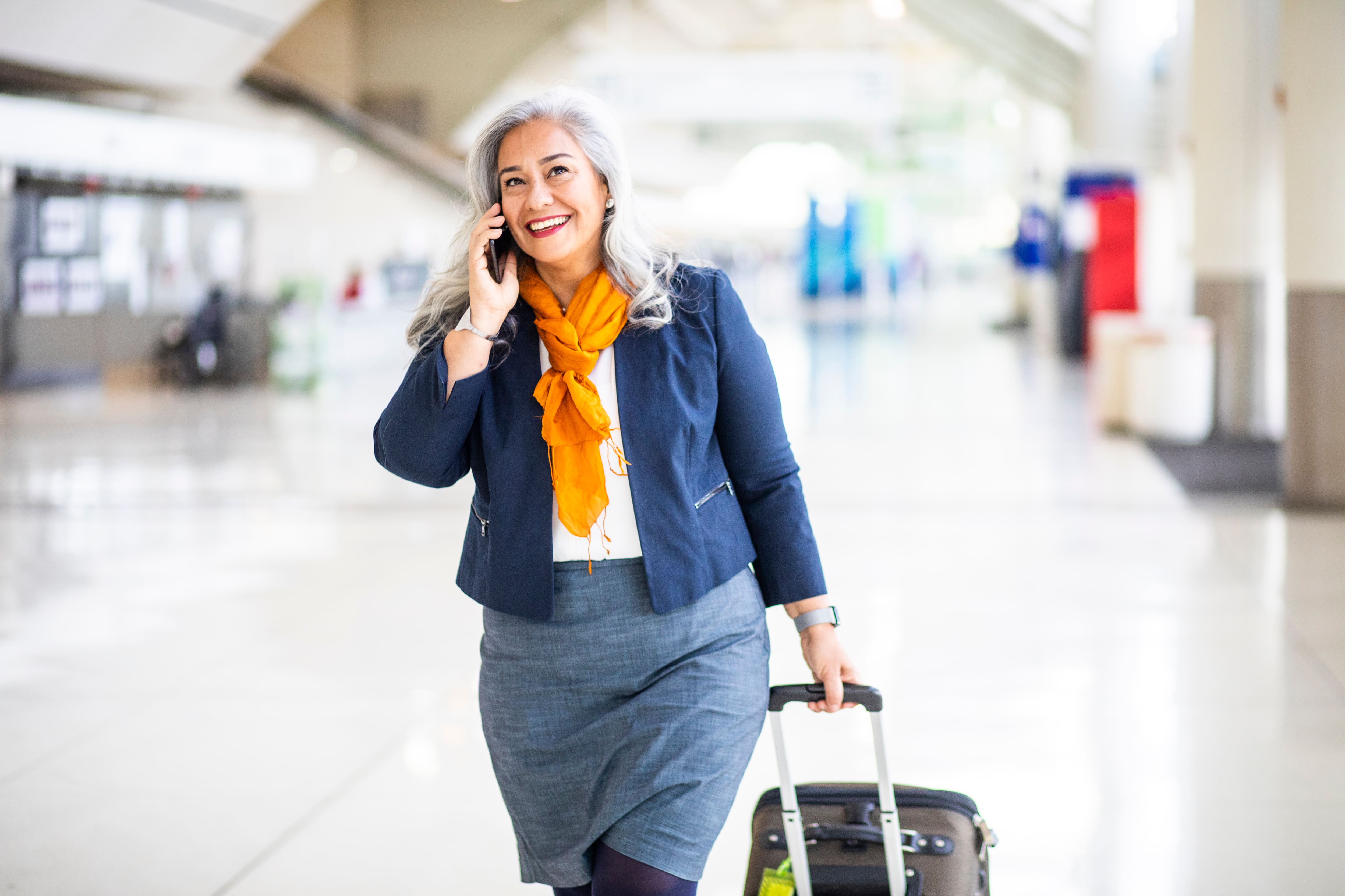 a woman with a carry-on luggage