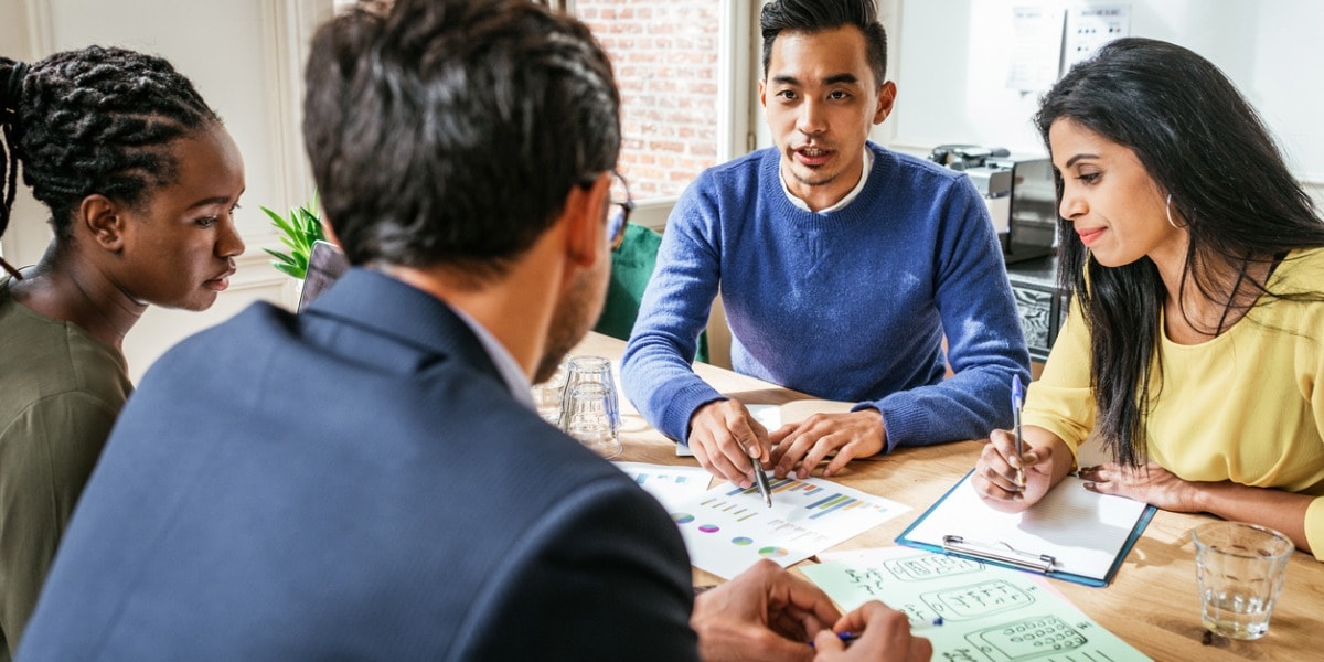 coworkers collaborating at a desk