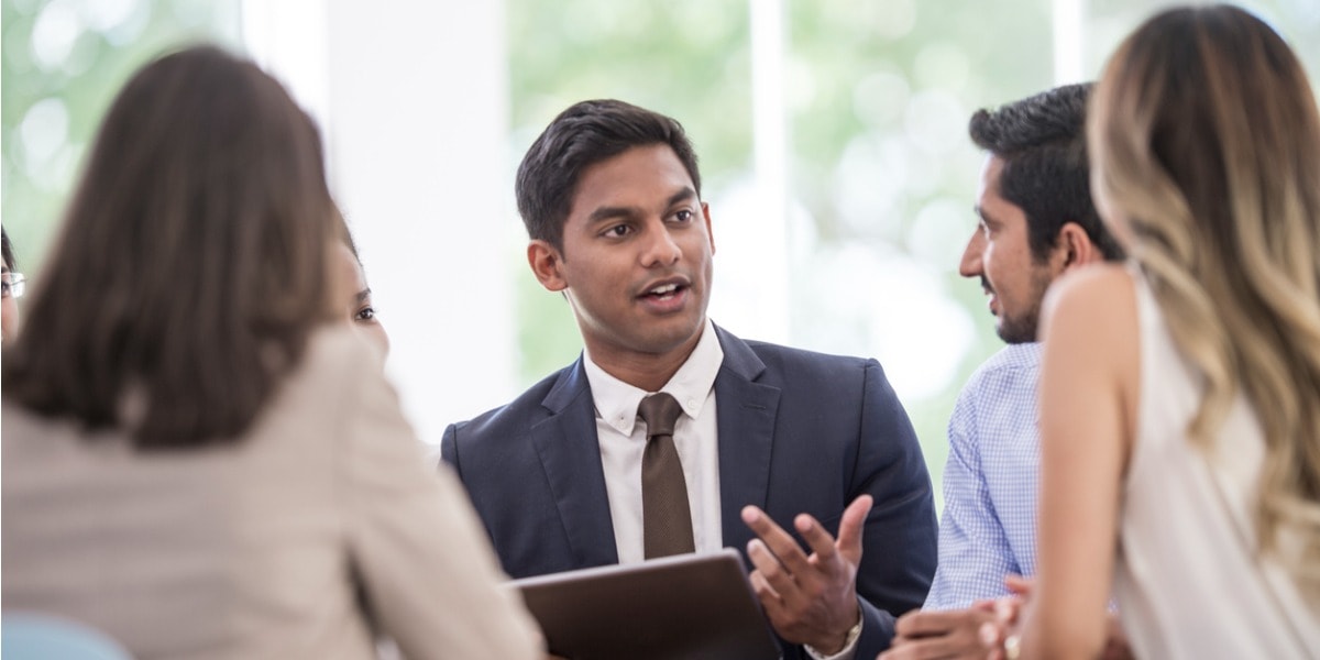 businessman in suit speaking during meeting