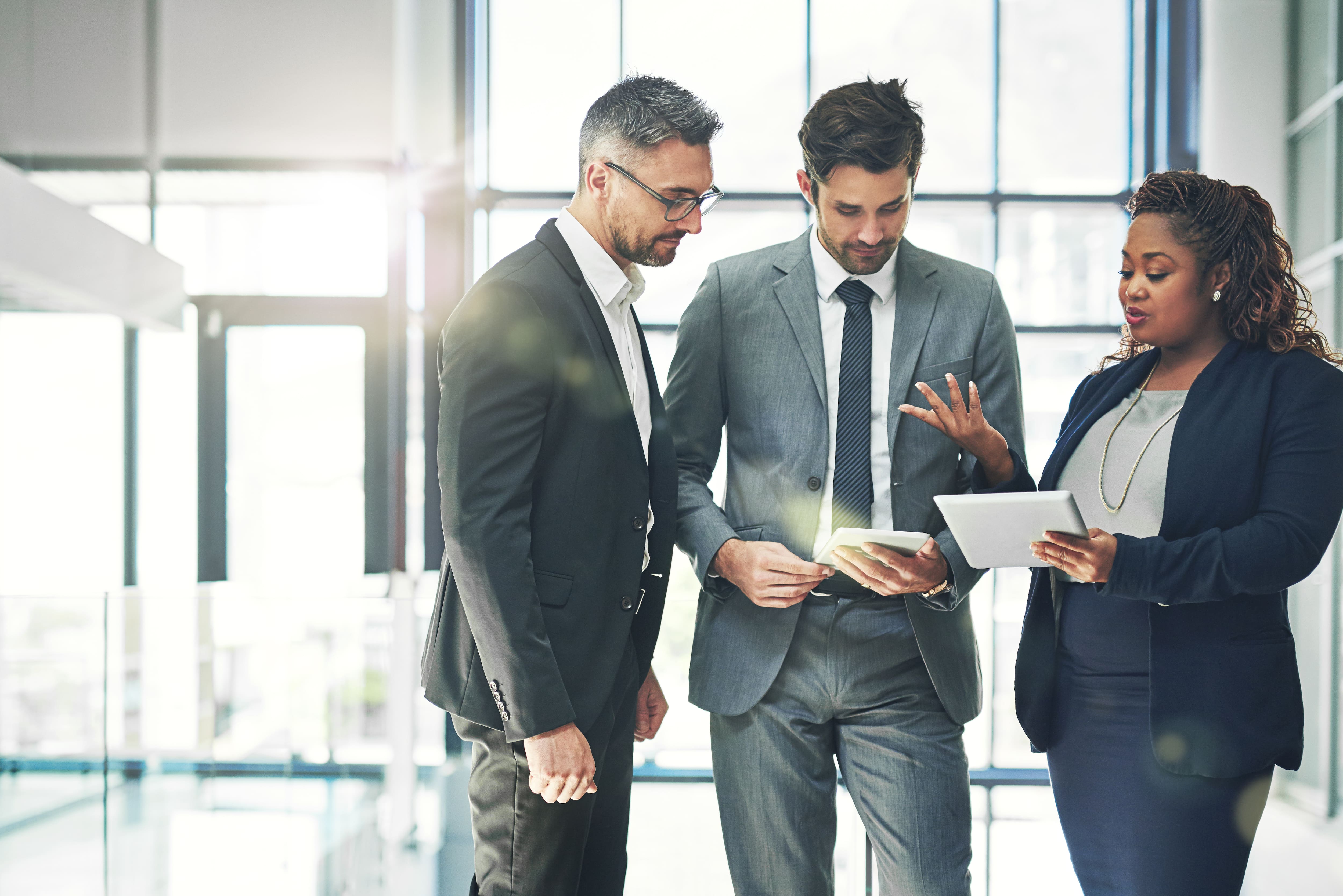 3 people having business discussion