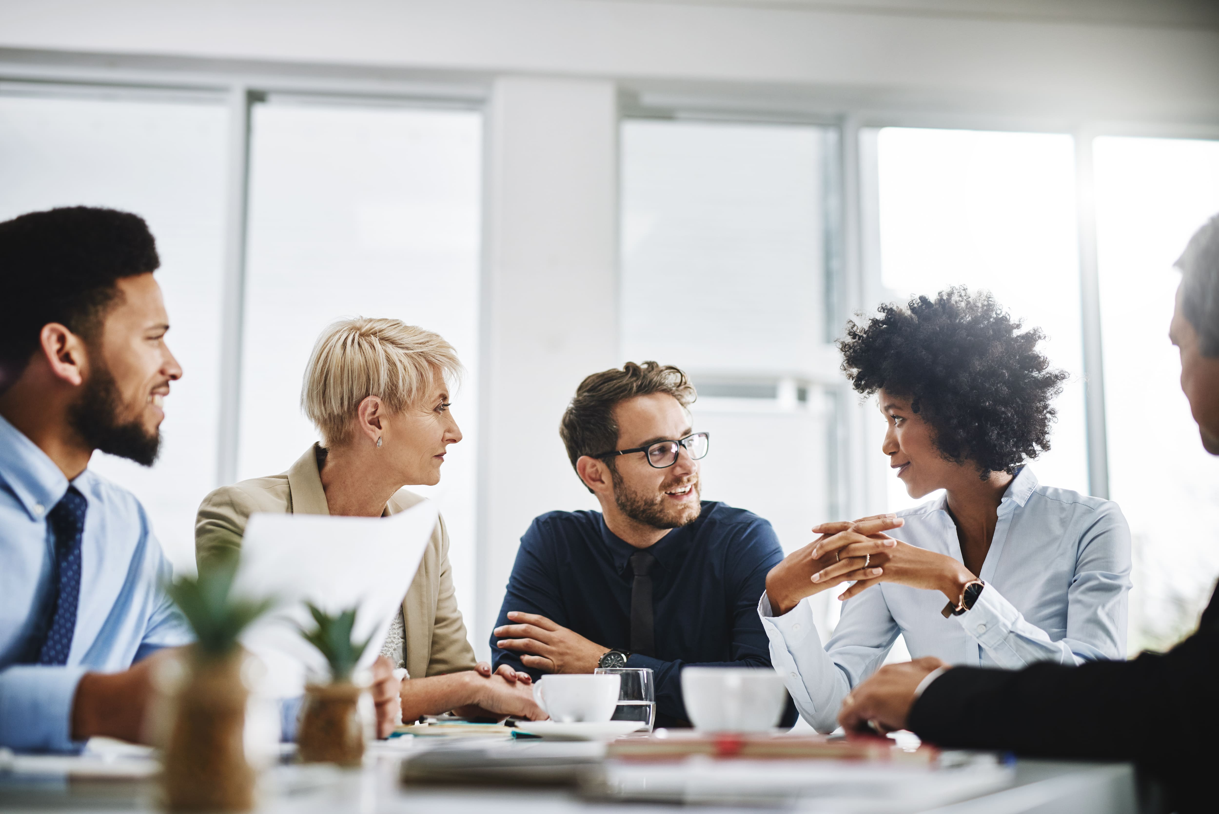 Group of people at a table talking