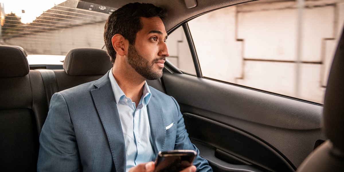 man travelling by car