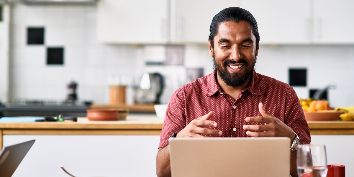 man in virtual meeting from home