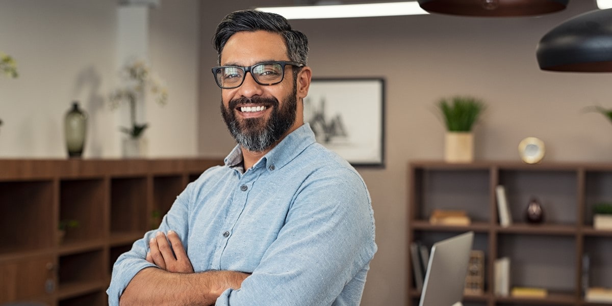 man smiling, office setting