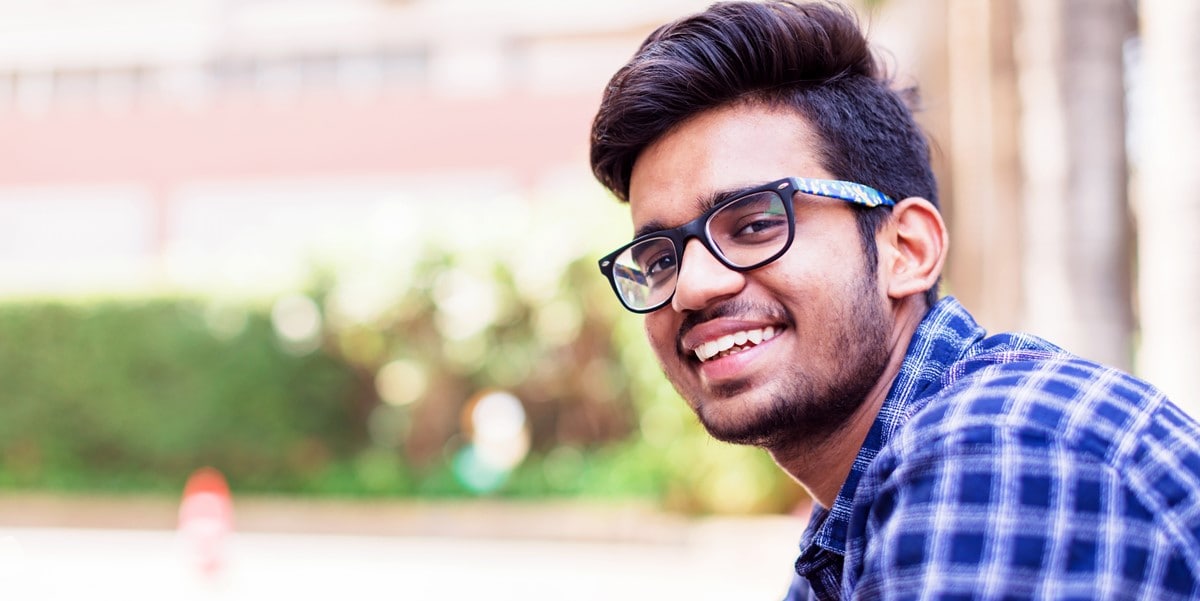 man smiling outdoors