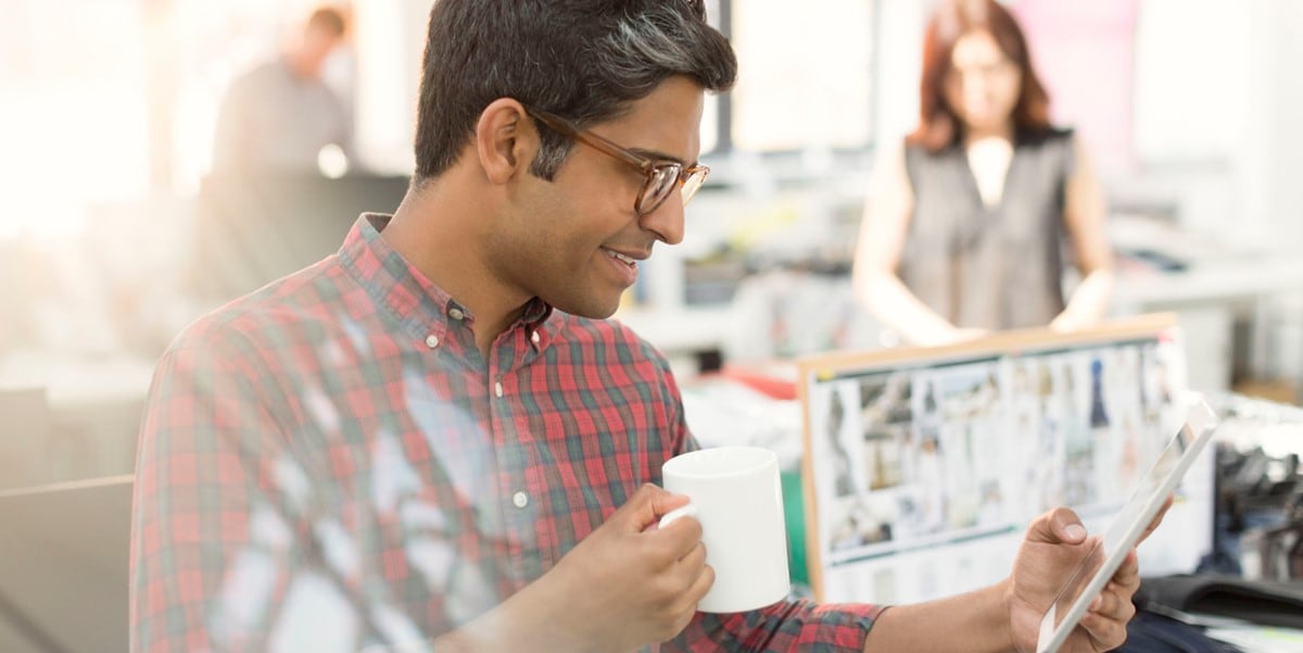 man reading document in office