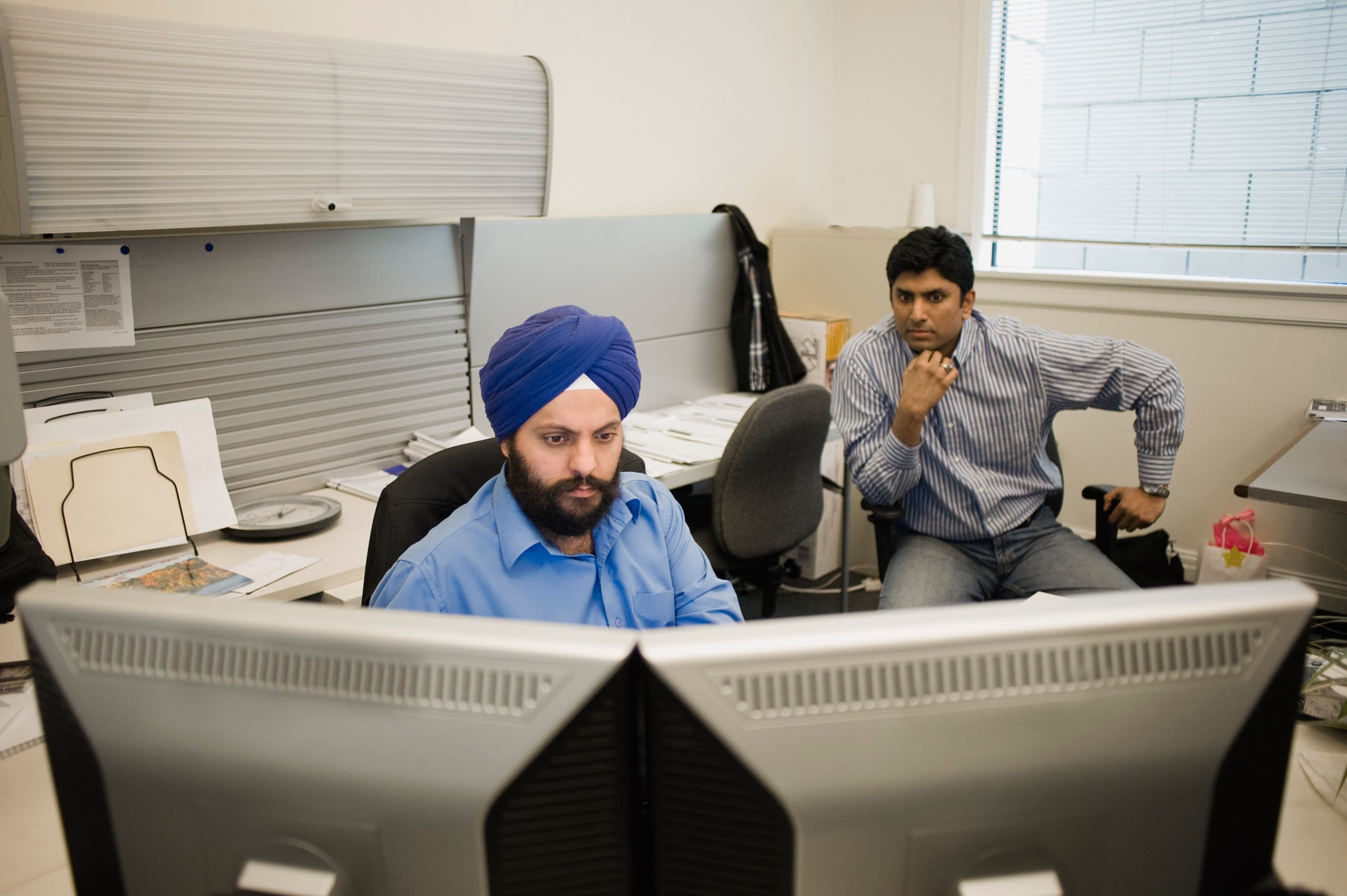 coworkers collaborating at a desk