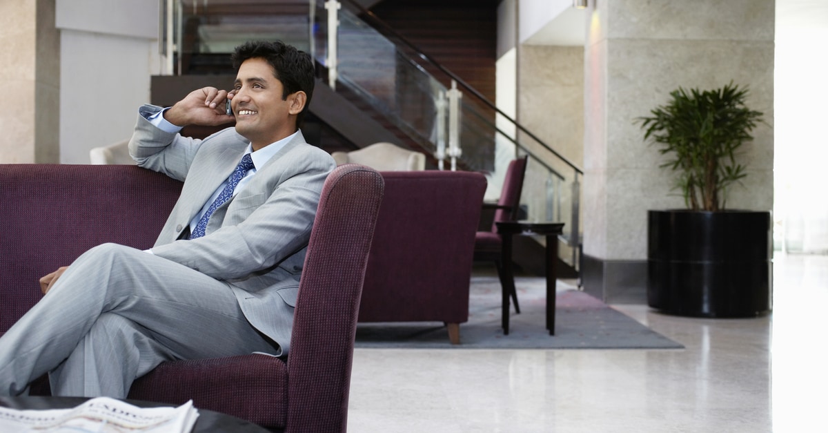 business man in a suit talking on the phone