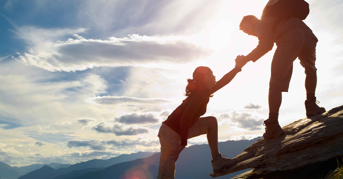 people hiking a mountain