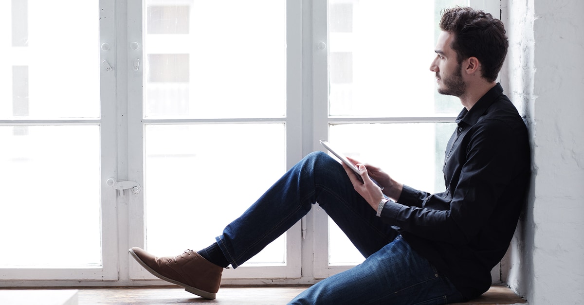 businessman looking out of the window at the office