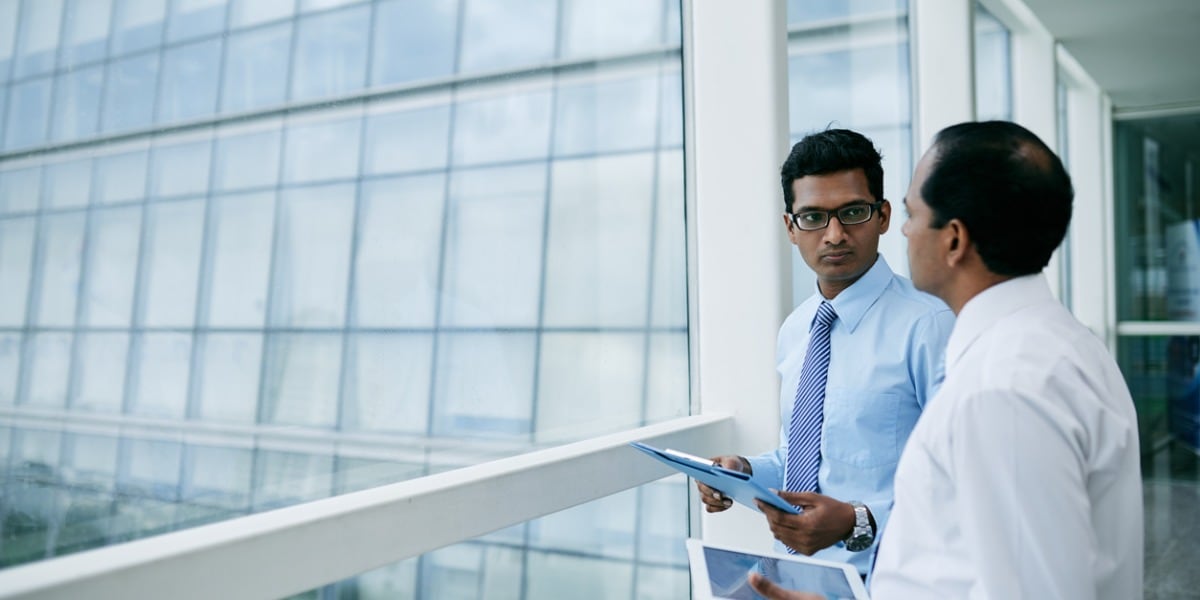 two businessmen in an office
