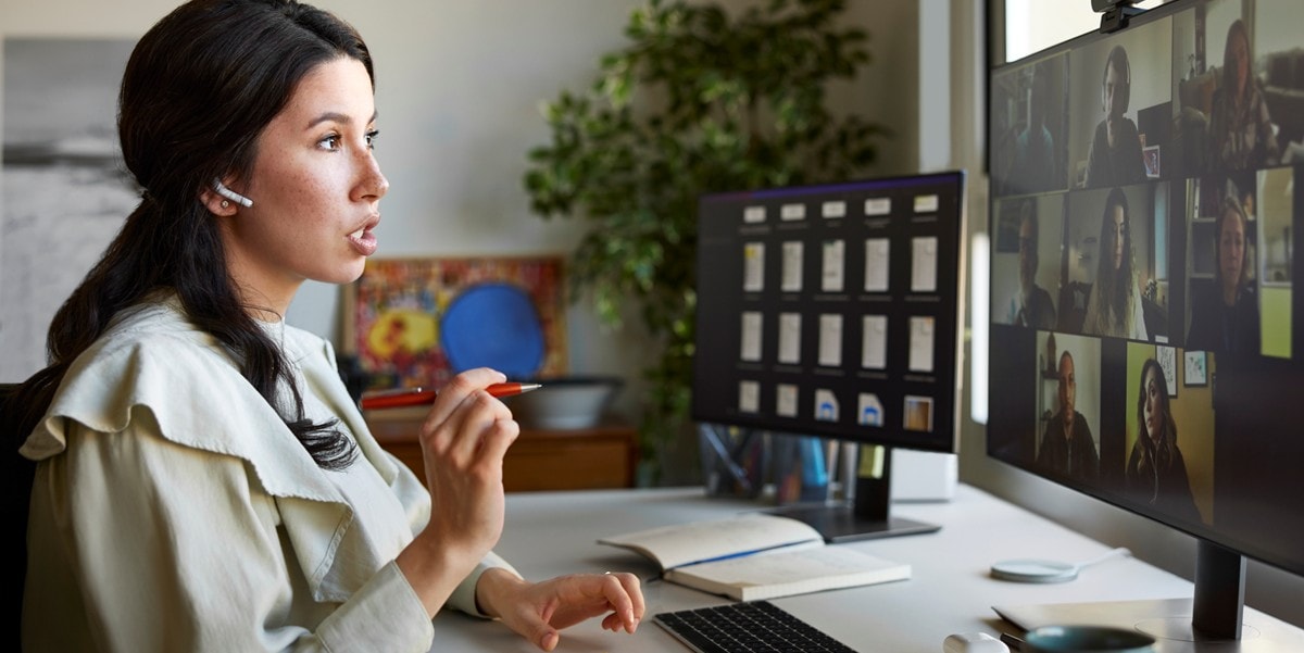 woman working in an office, on a virtual call