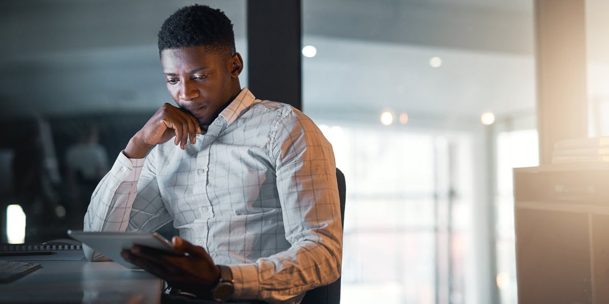Man looking at tablet