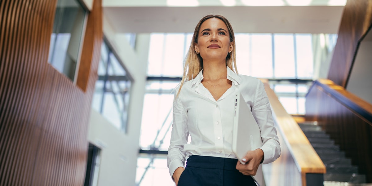 A business woman walking in the hall way