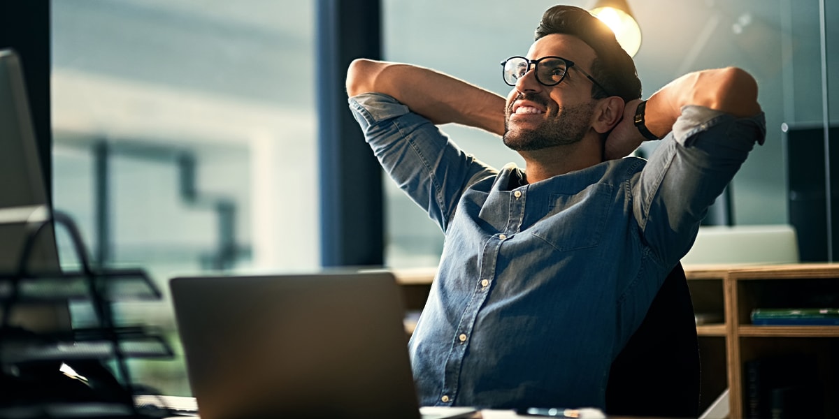 Man smiling at computer