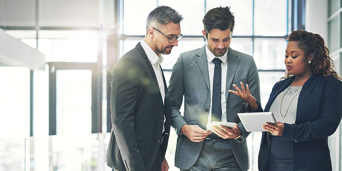 3 people having business discussion