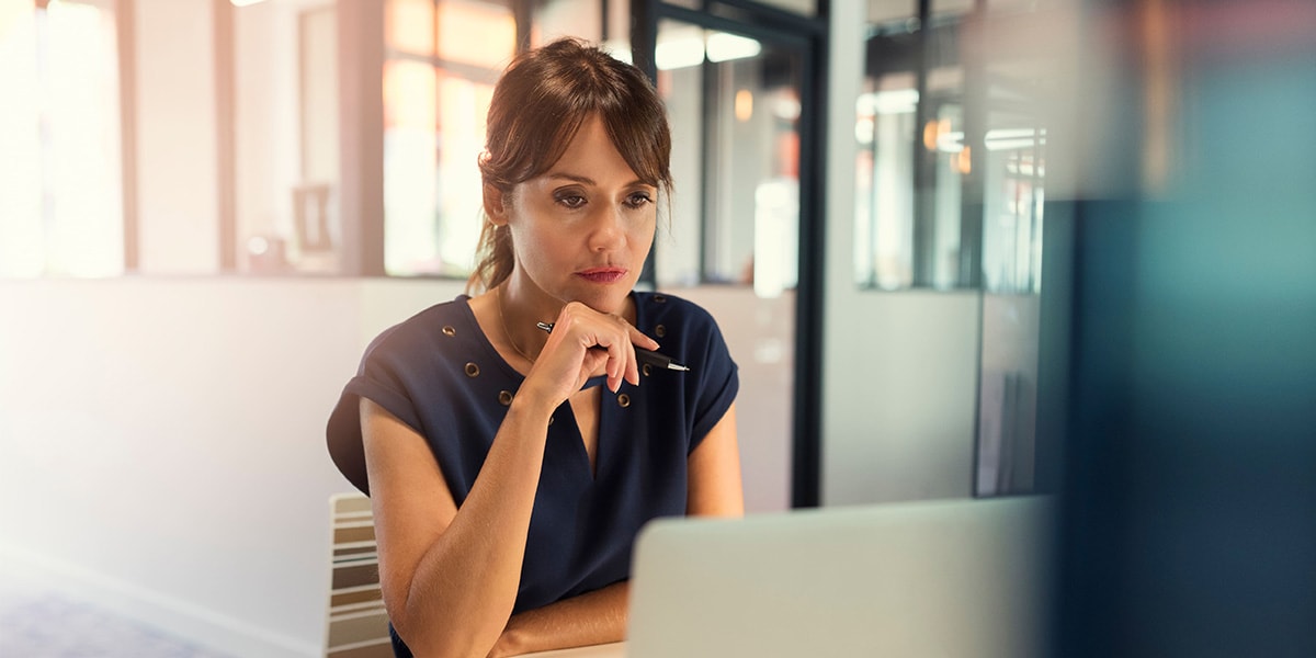 a woman looking at the laptop