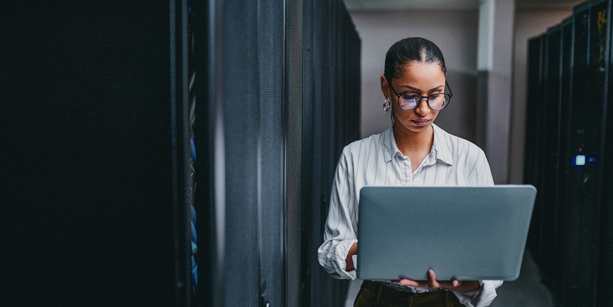 professional woman holding laptop