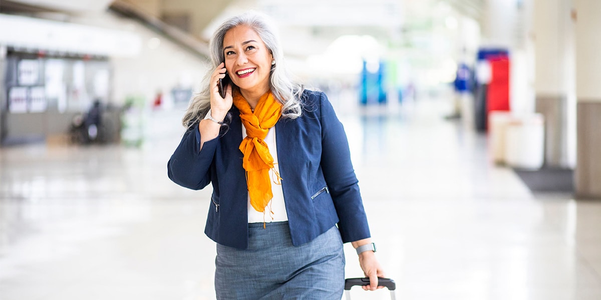 a woman with a carry-on luggage
