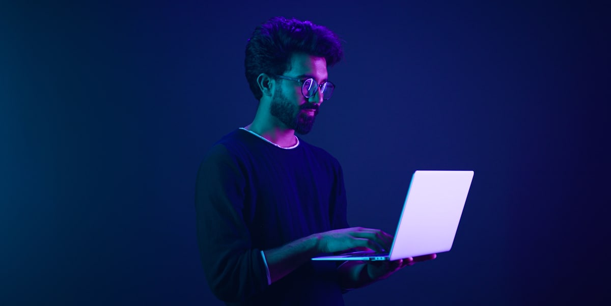 man holding a laptop