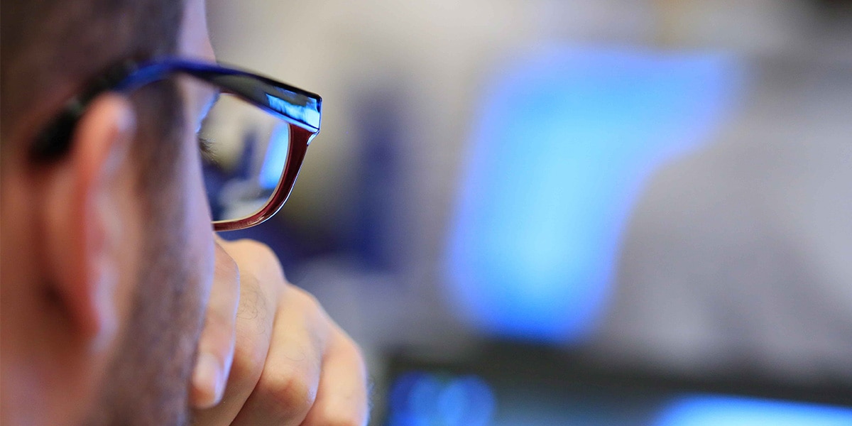 man looking at a screen