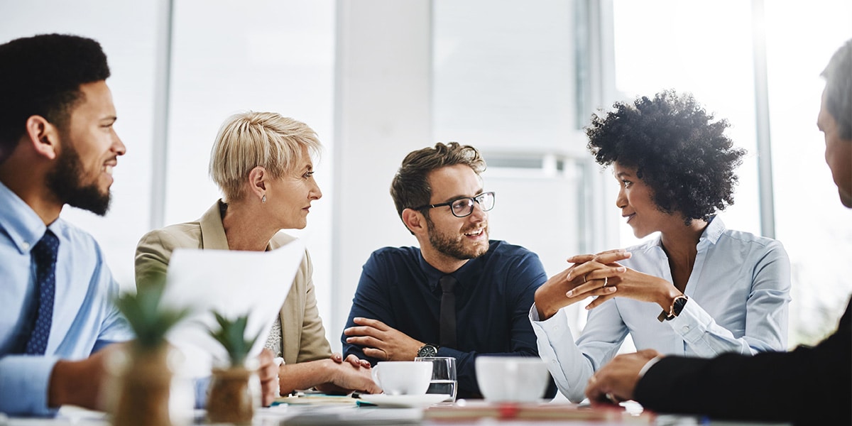 Group of people at a table talking