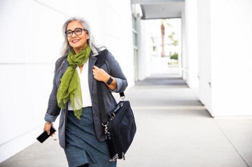 woman walking along corridor