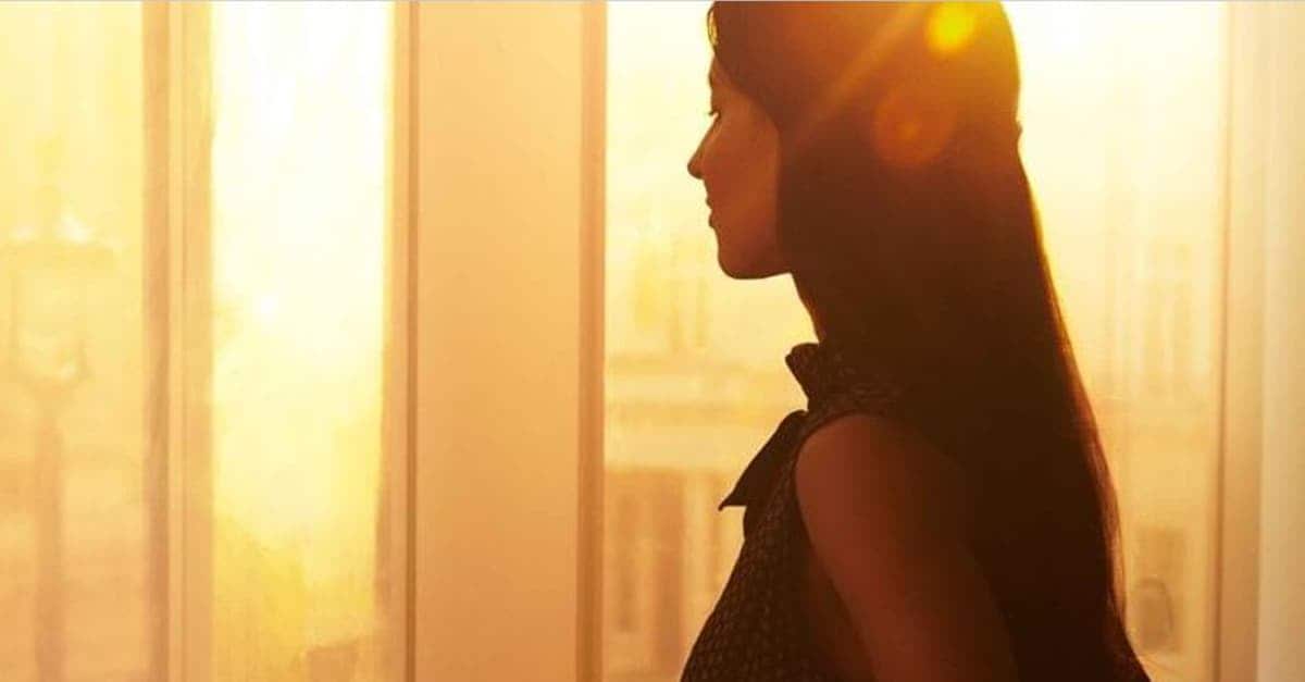 woman in the office looking out of the window