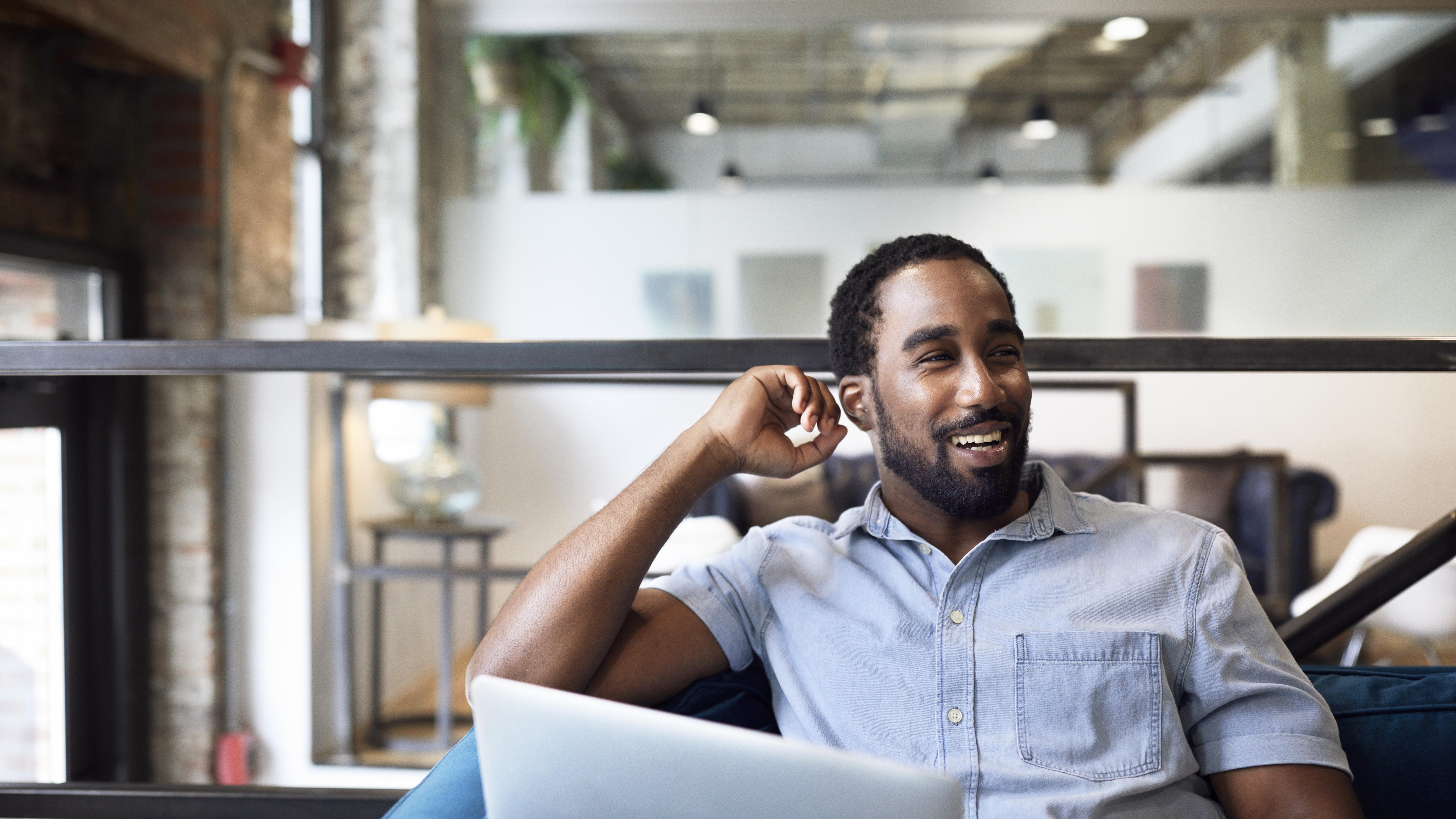 happy worker at laptop
