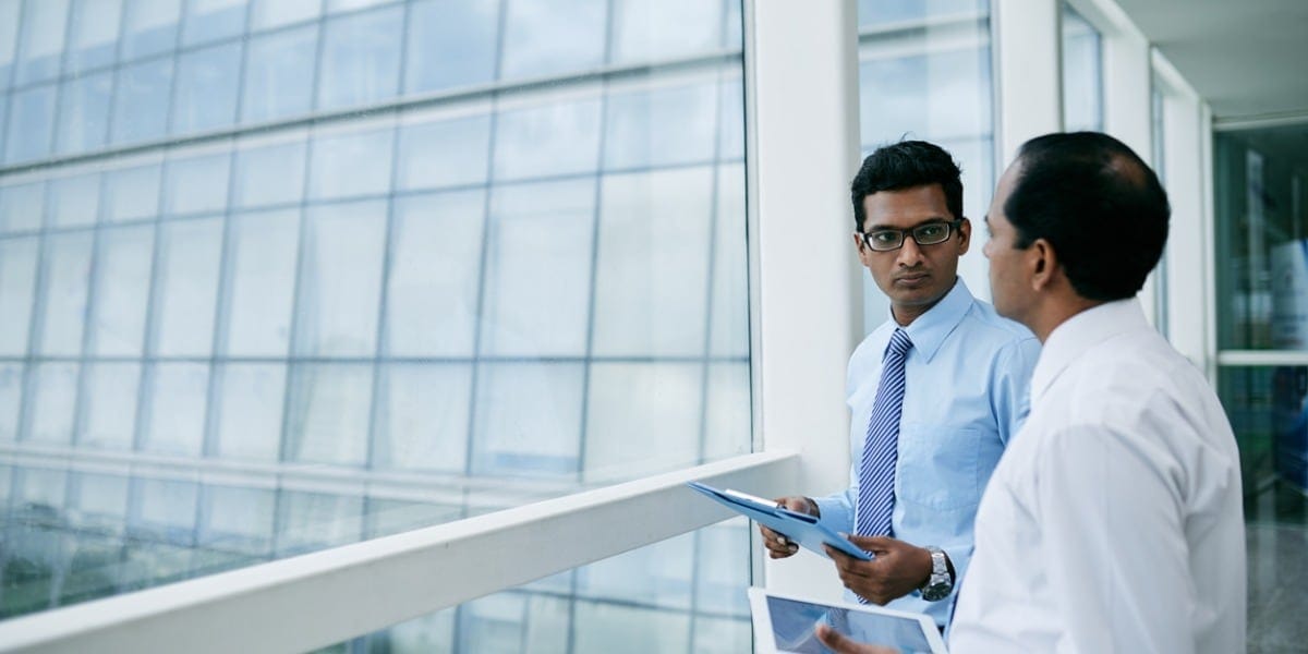 two businessmen in an office